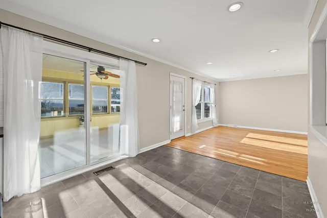 a view of an empty room with glass door