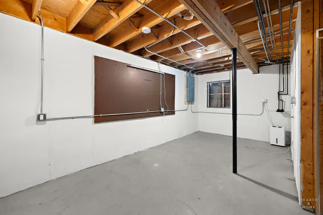 a view of livingroom with wooden floor and flat screen tv