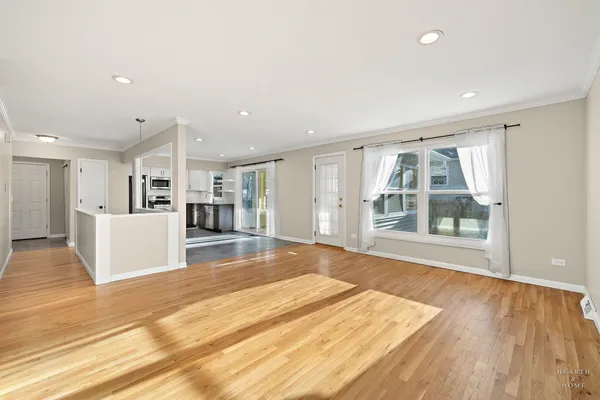 a view of kitchen with furniture and wooden floor