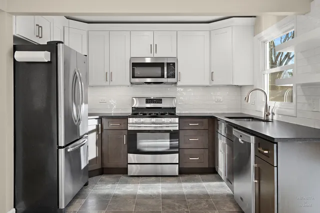 a kitchen with a refrigerator stove and sink