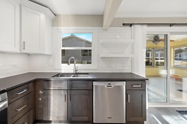 a kitchen with a sink and cabinets