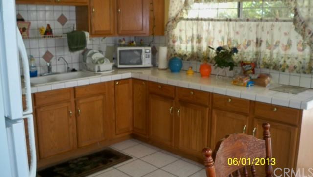 4856 Corwin Lane Riverside, CA 92503 - Photo 1 of 1 a kitchen with a sink and cabinets
