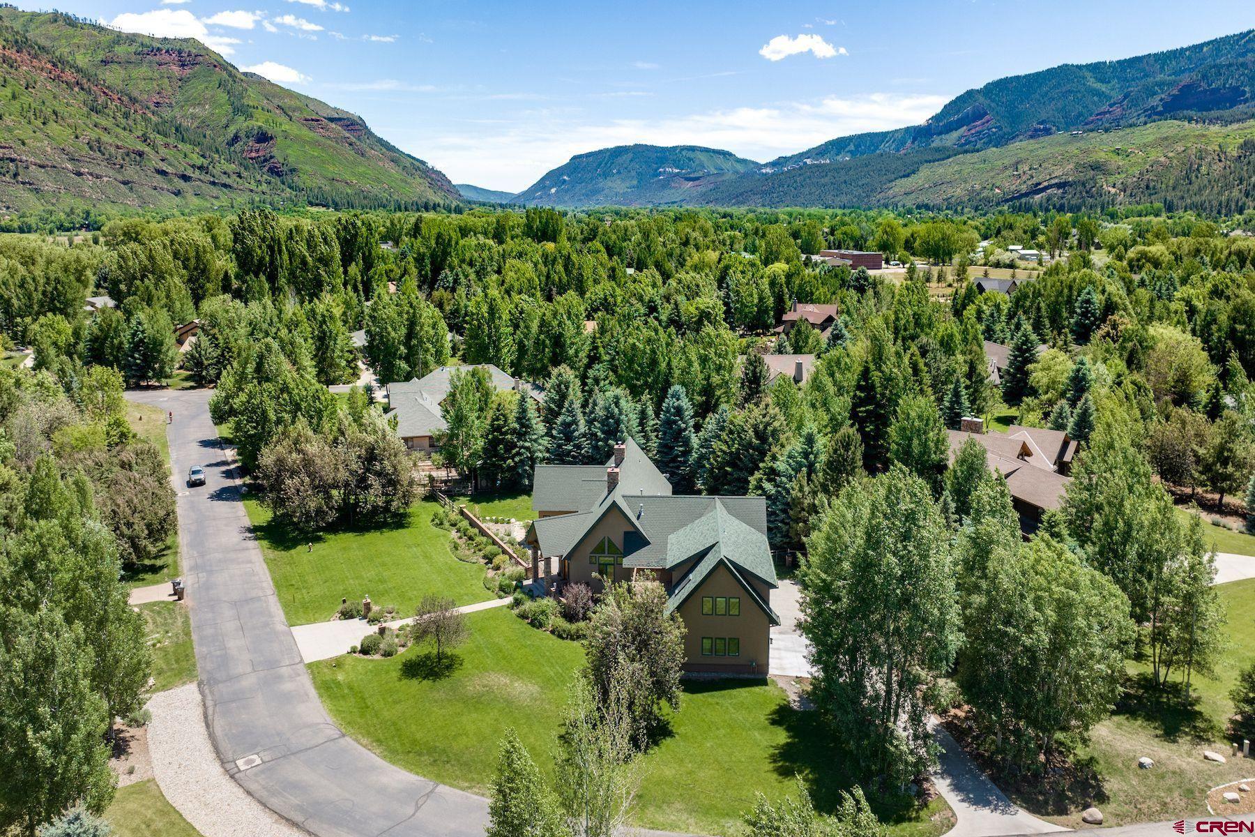 605 Red Rock Road Durango, CO 81301 - Photo 33 of 35 an aerial view of a house with pool plants and large trees