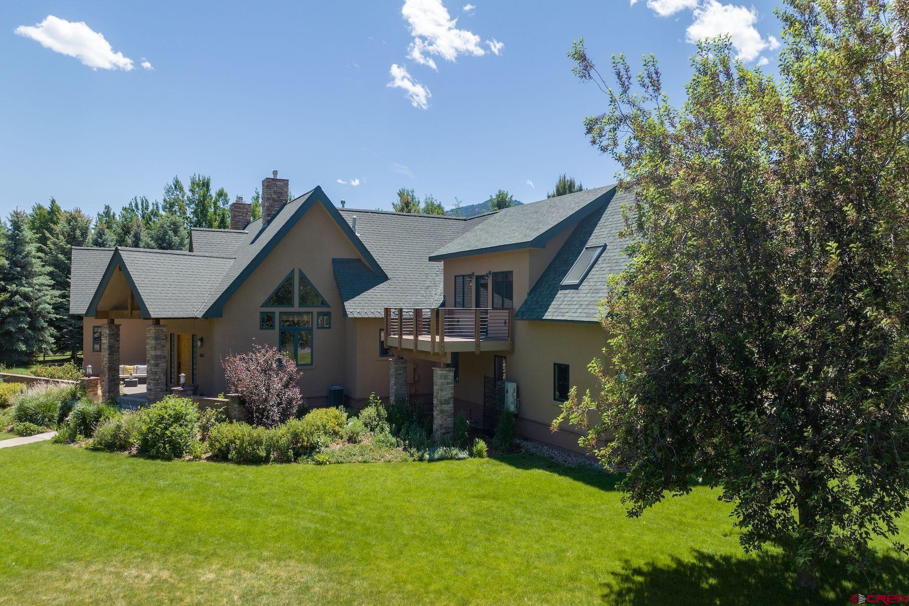 605 Red Rock Road Durango, CO 81301 - Photo 34 of 35 a front view of a house with a garden