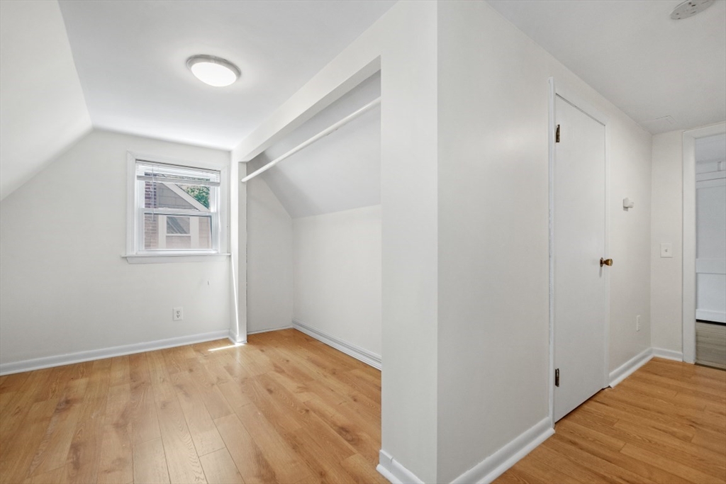 129 Virginia Road Waltham, MA 02453 - Photo 17 of 27 a view of a room with wooden floor and windows