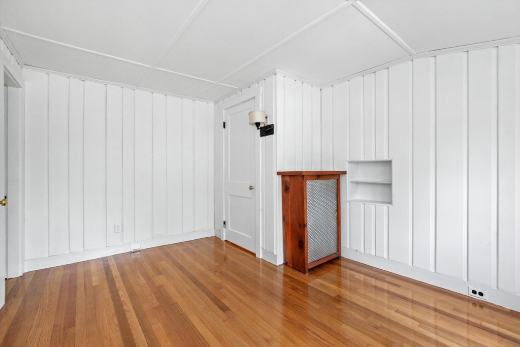 129 Virginia Road Waltham, MA 02453 - Photo 19 of 27 a view of an empty room with wooden floor