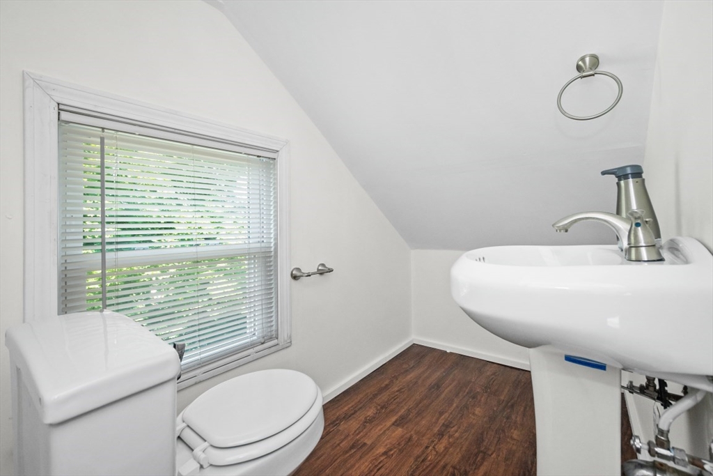 129 Virginia Road Waltham, MA 02453 - Photo 22 of 27 a bathroom with a toilet a sink and a mirror