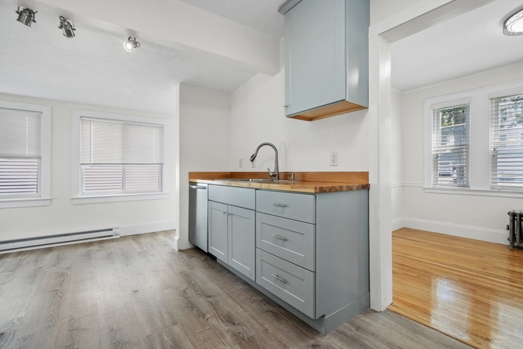 129 Virginia Road Waltham, MA 02453 - Photo 4 of 27 a room with a sink cabinets and a window