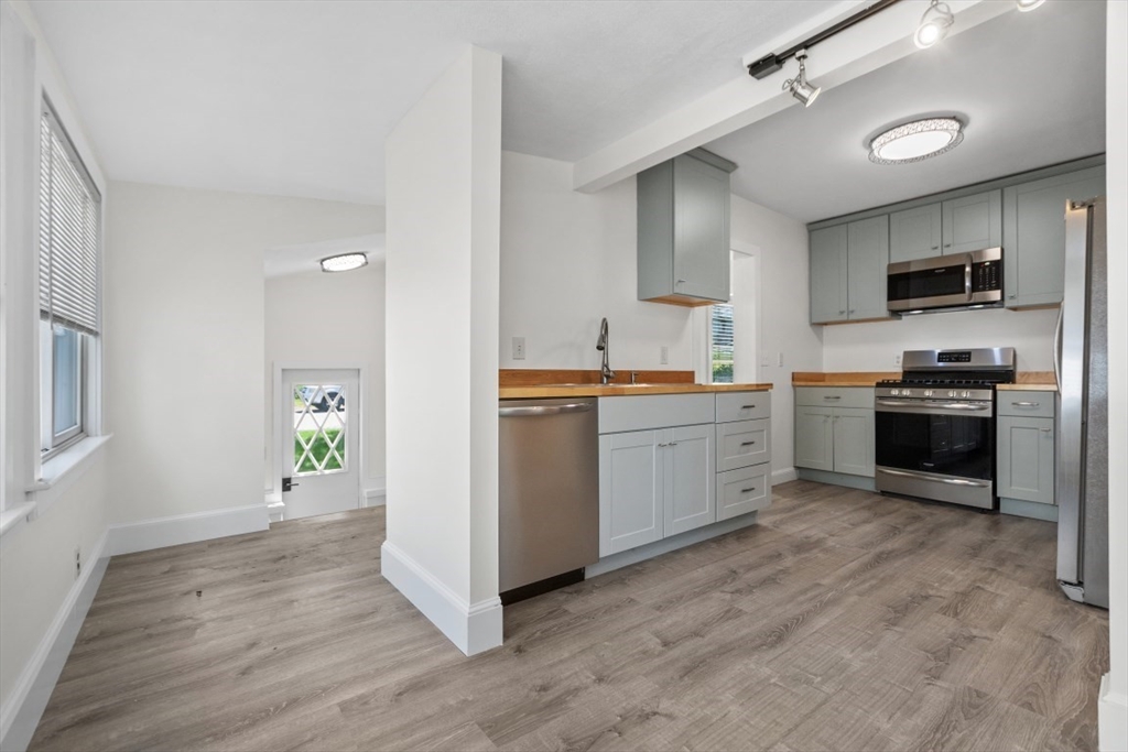 129 Virginia Road Waltham, MA 02453 - Photo 7 of 27 a view of kitchen with sink and cabinets