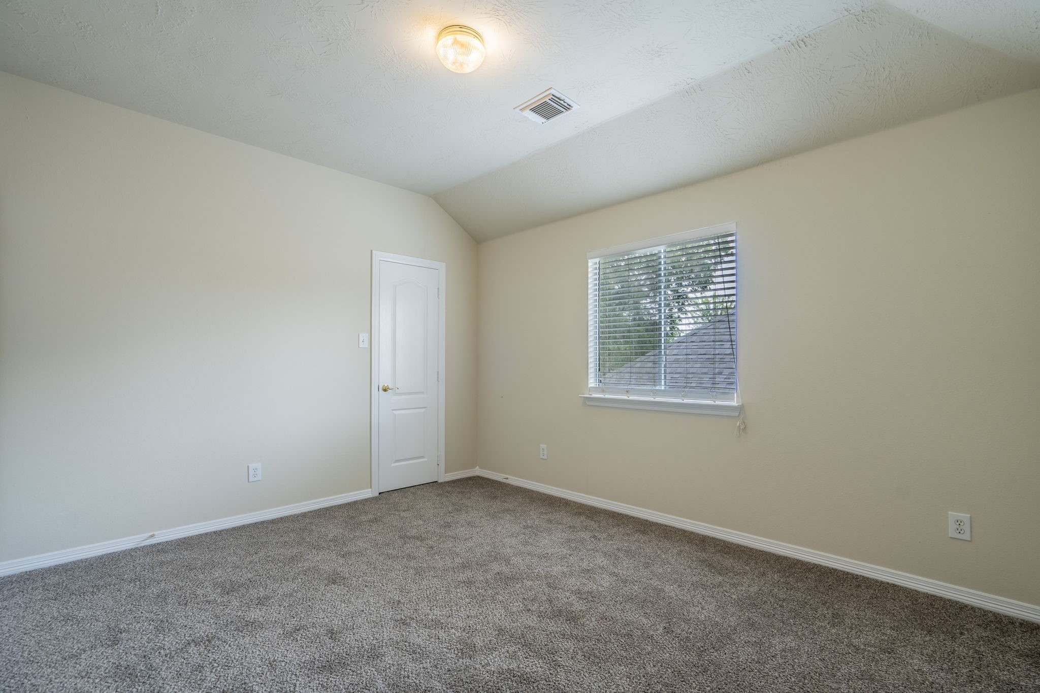24139 Spring Sunset Drive Spring, TX 77373 - Photo 21 of 26 an empty room with a window