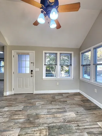 a view of an empty room with a window