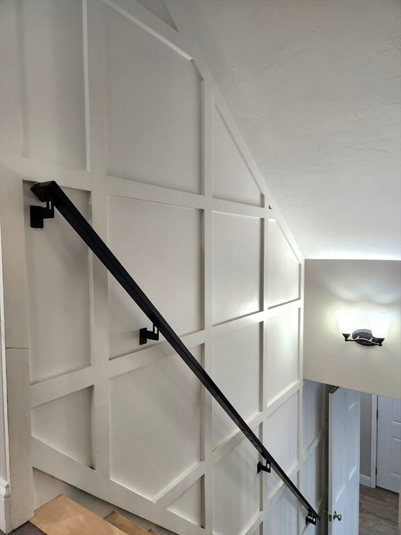 42 Ancona Road Worcester, MA 01604 - Photo 25 of 42 a view of staircase with white walls and railing