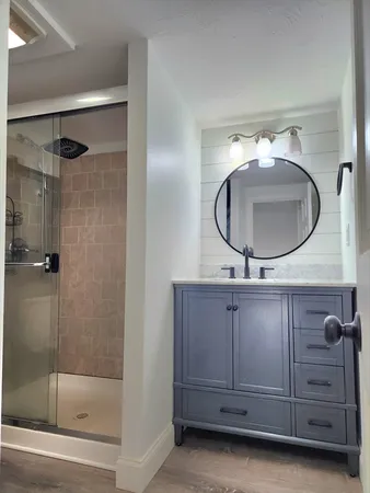 a bathroom with a mirror and a sink