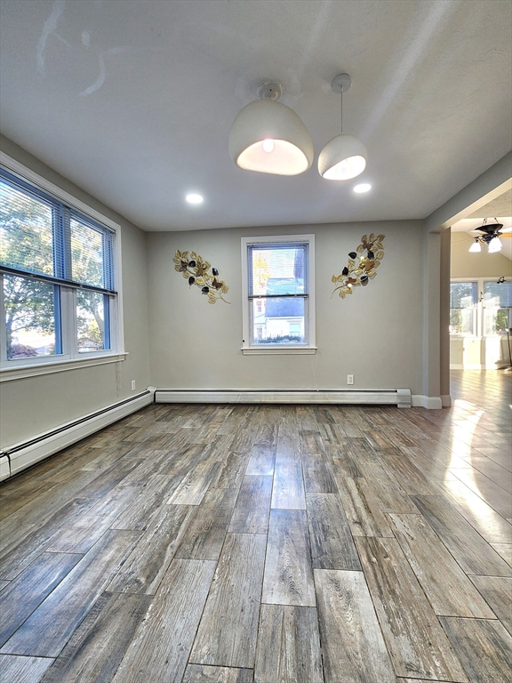 42 Ancona Road Worcester, MA 01604 - Photo 10 of 42 an empty room with wooden floor and windows