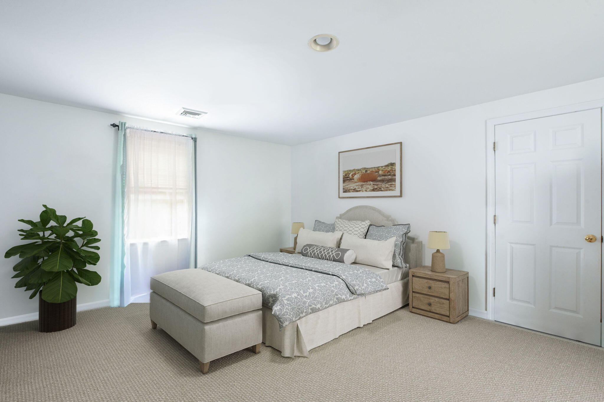 25 Harris Hill Road East Falmouth, MA 02536 - Photo 16 of 37 a spacious bedroom with a bed a wall painting and a potted plant