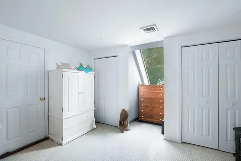 a view of a swimming pool with a patio and a yard