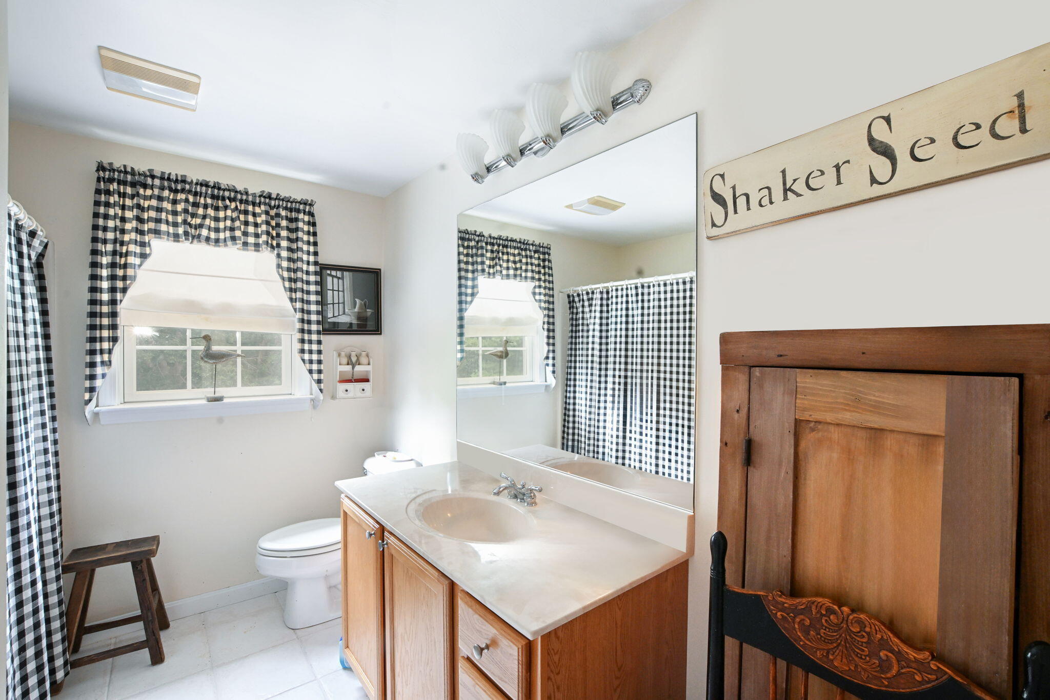 25 Harris Hill Road East Falmouth, MA 02536 - Photo 18 of 37 a bathroom with a toilet sink and mirror