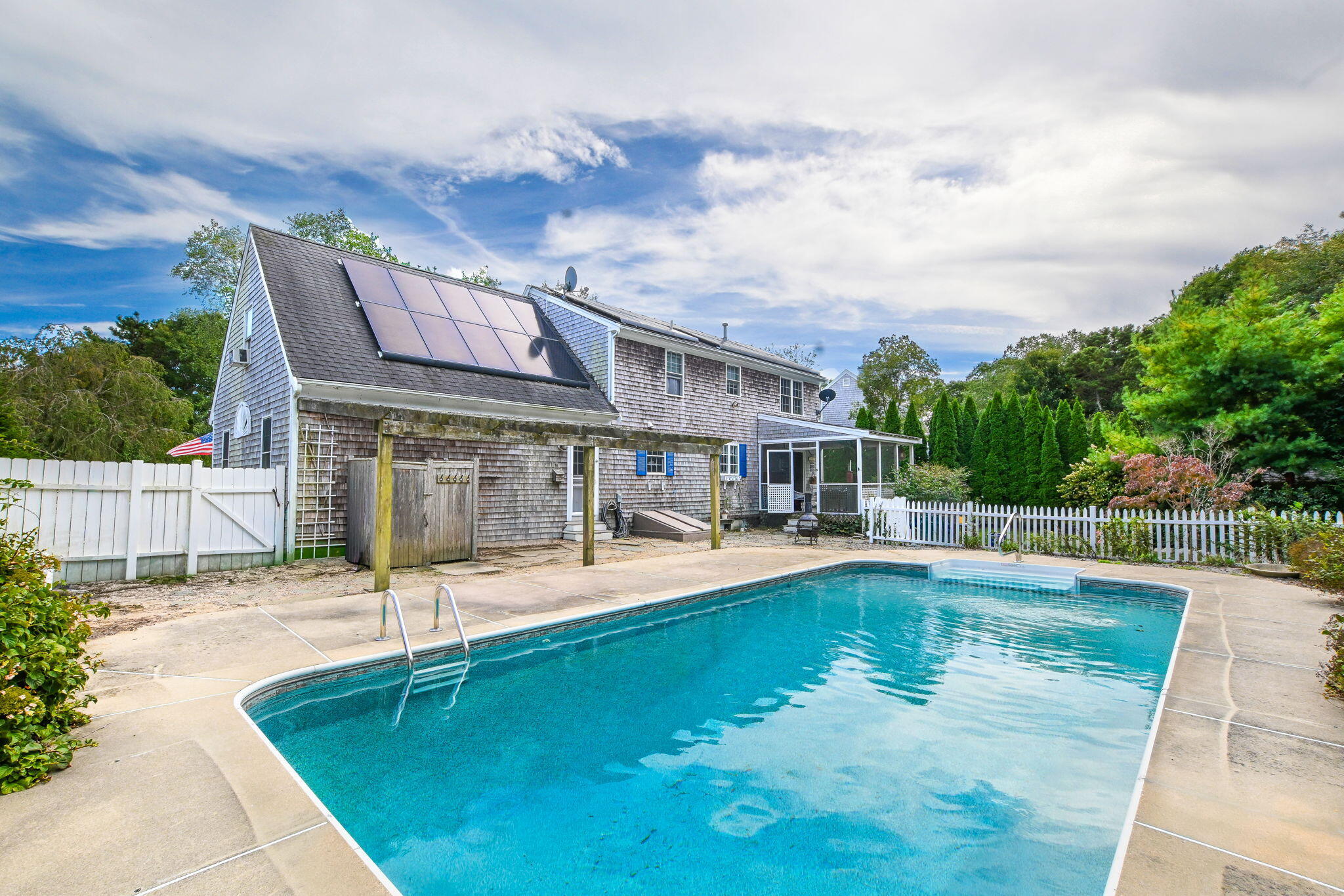 25 Harris Hill Road East Falmouth, MA 02536 - Photo 4 of 37 a swimming pool with outdoor seating and yard