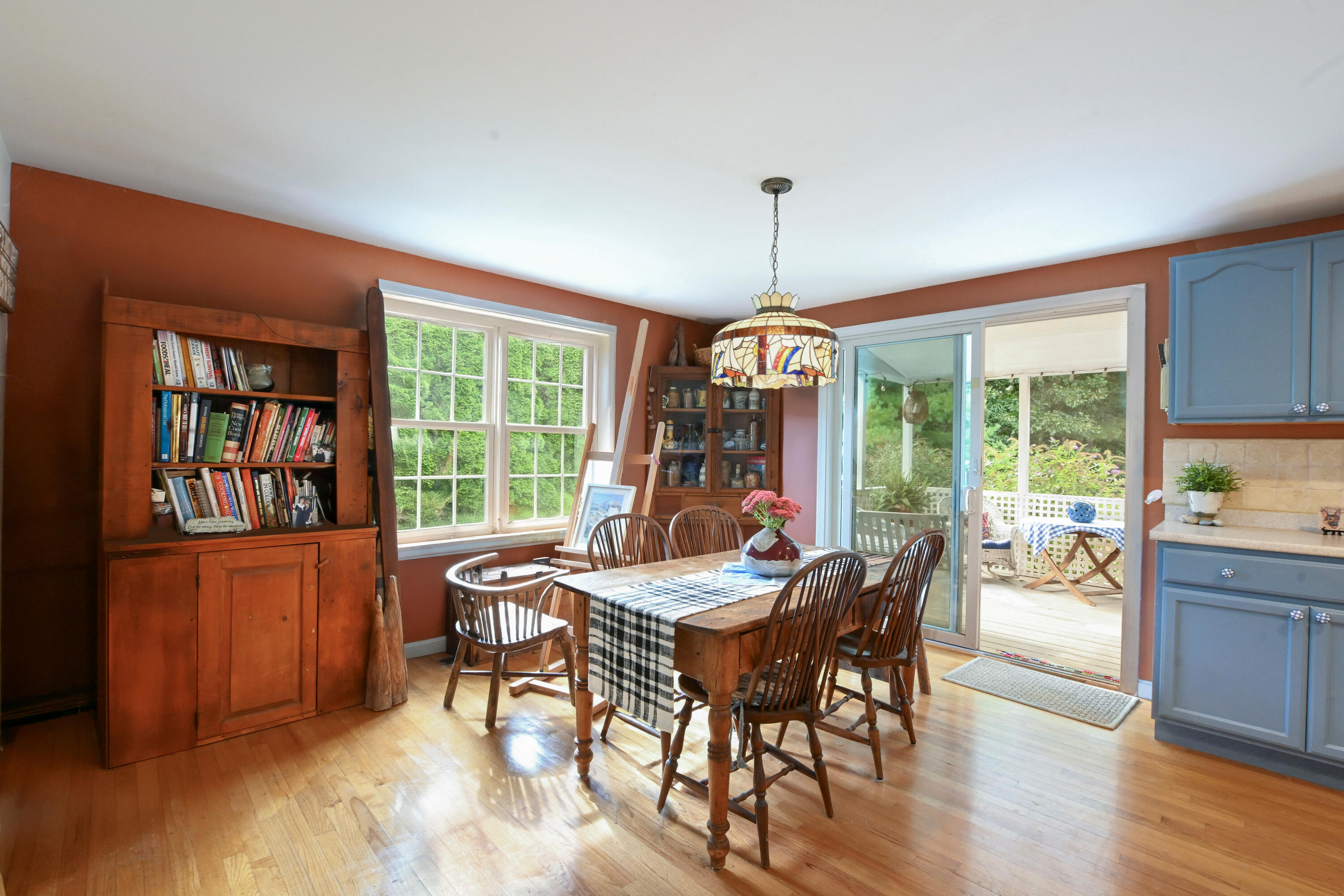 25 Harris Hill Road East Falmouth, MA 02536 - Photo 9 of 37 a view of a dining room with furniture large windows and wooden floor