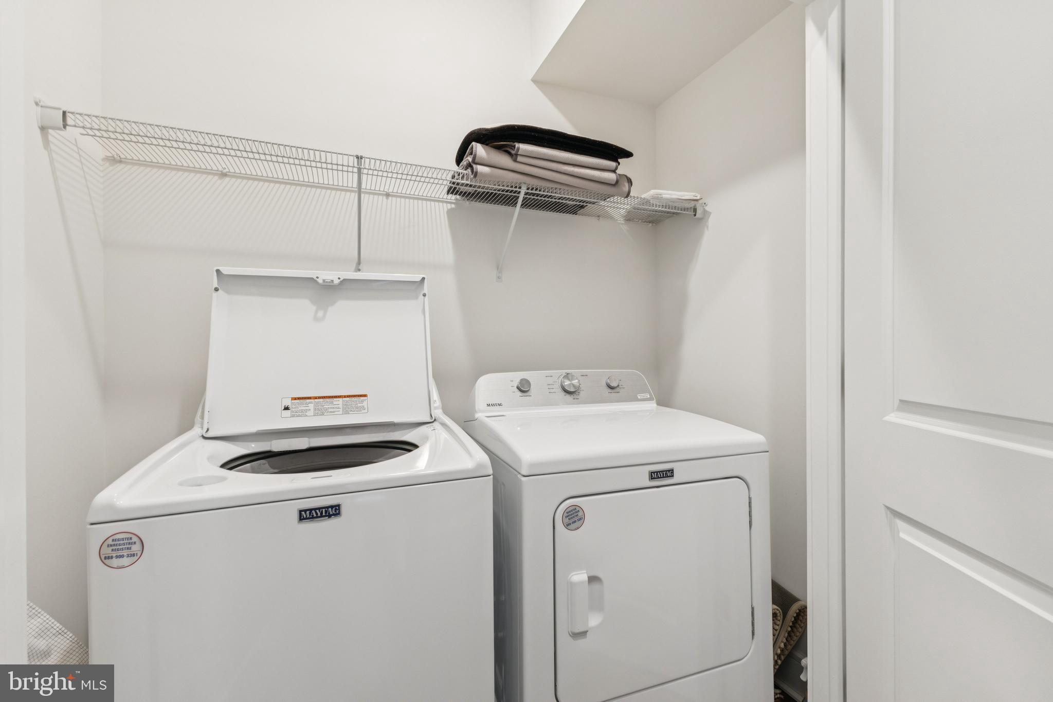 42597 Nubbins Terrace Ashburn, VA 20147 - Photo 28 of 40 a utility room with dryer and washer