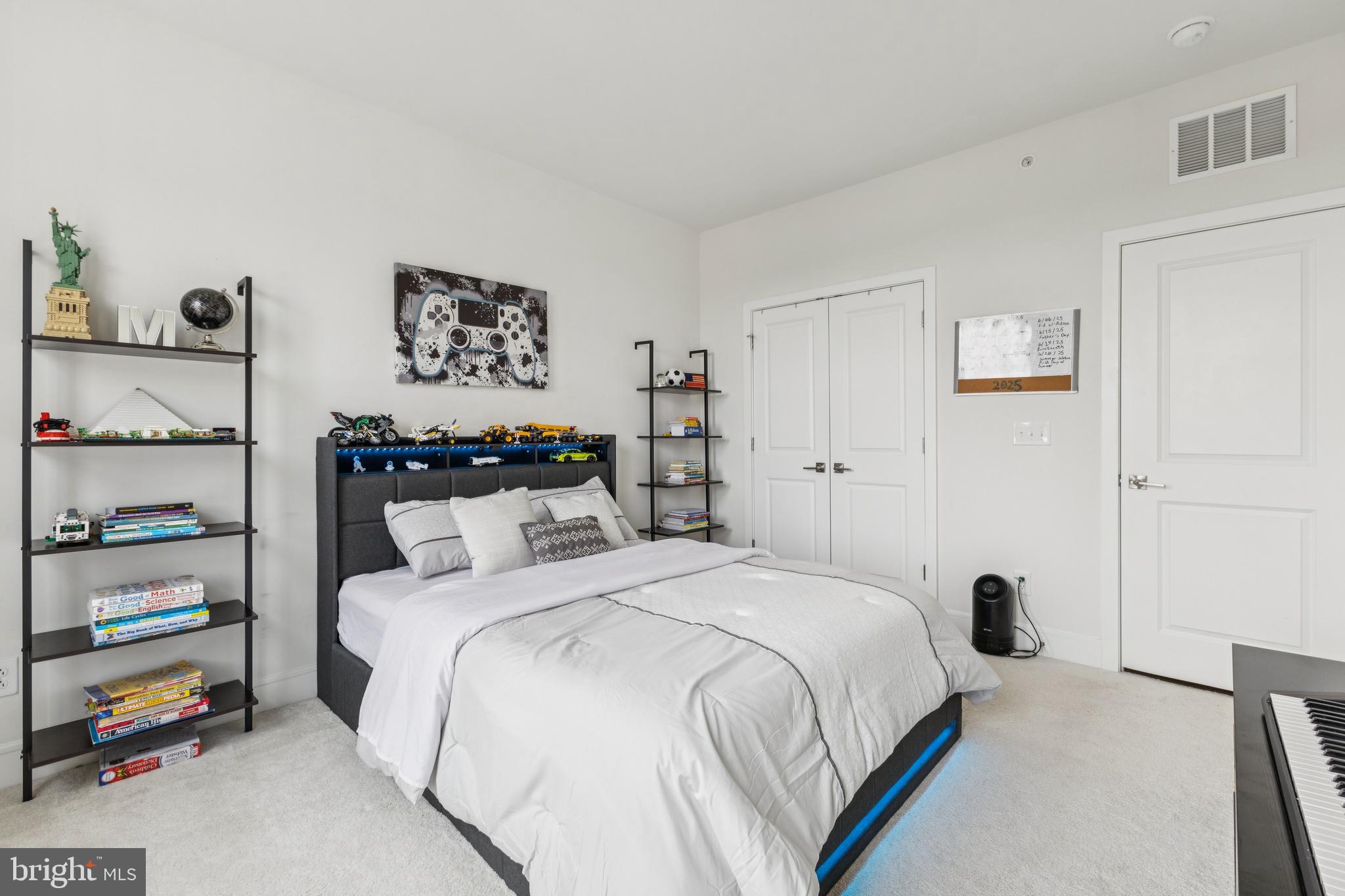 42597 Nubbins Terrace Ashburn, VA 20147 - Photo 31 of 40 a bedroom with a bed and a cabinets