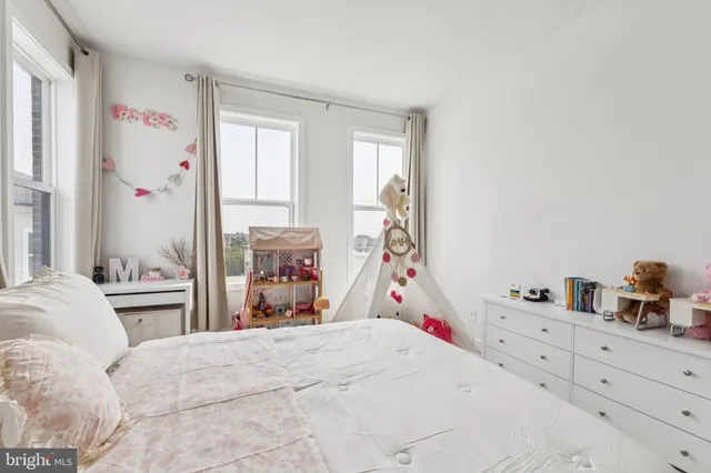 a bedroom with a bed and a closet