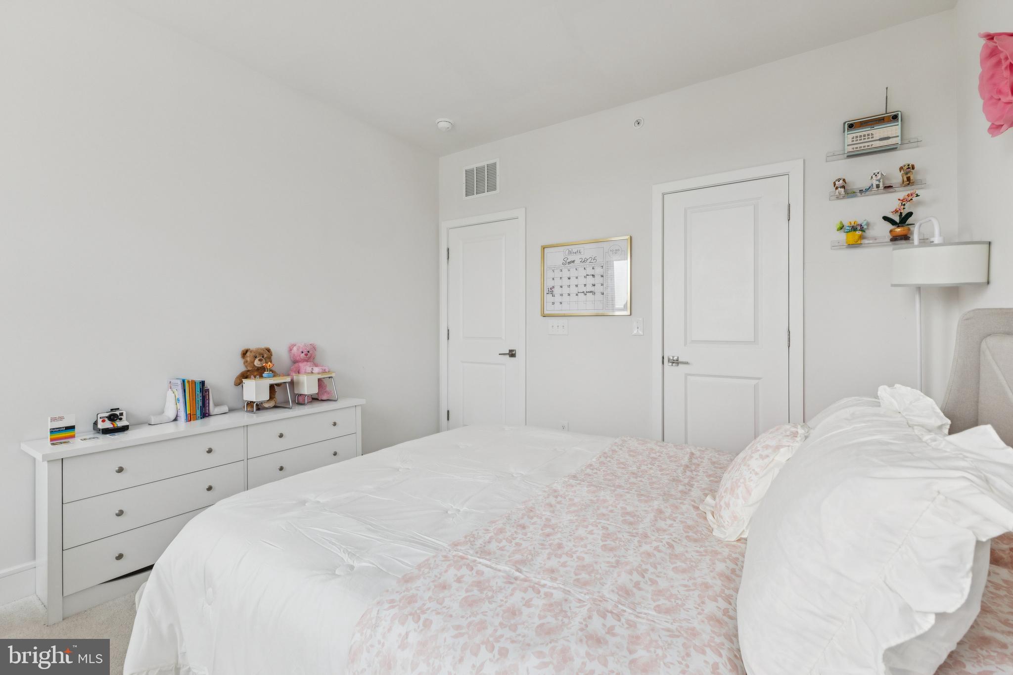 42597 Nubbins Terrace Ashburn, VA 20147 - Photo 36 of 40 a bedroom with a bed and a window