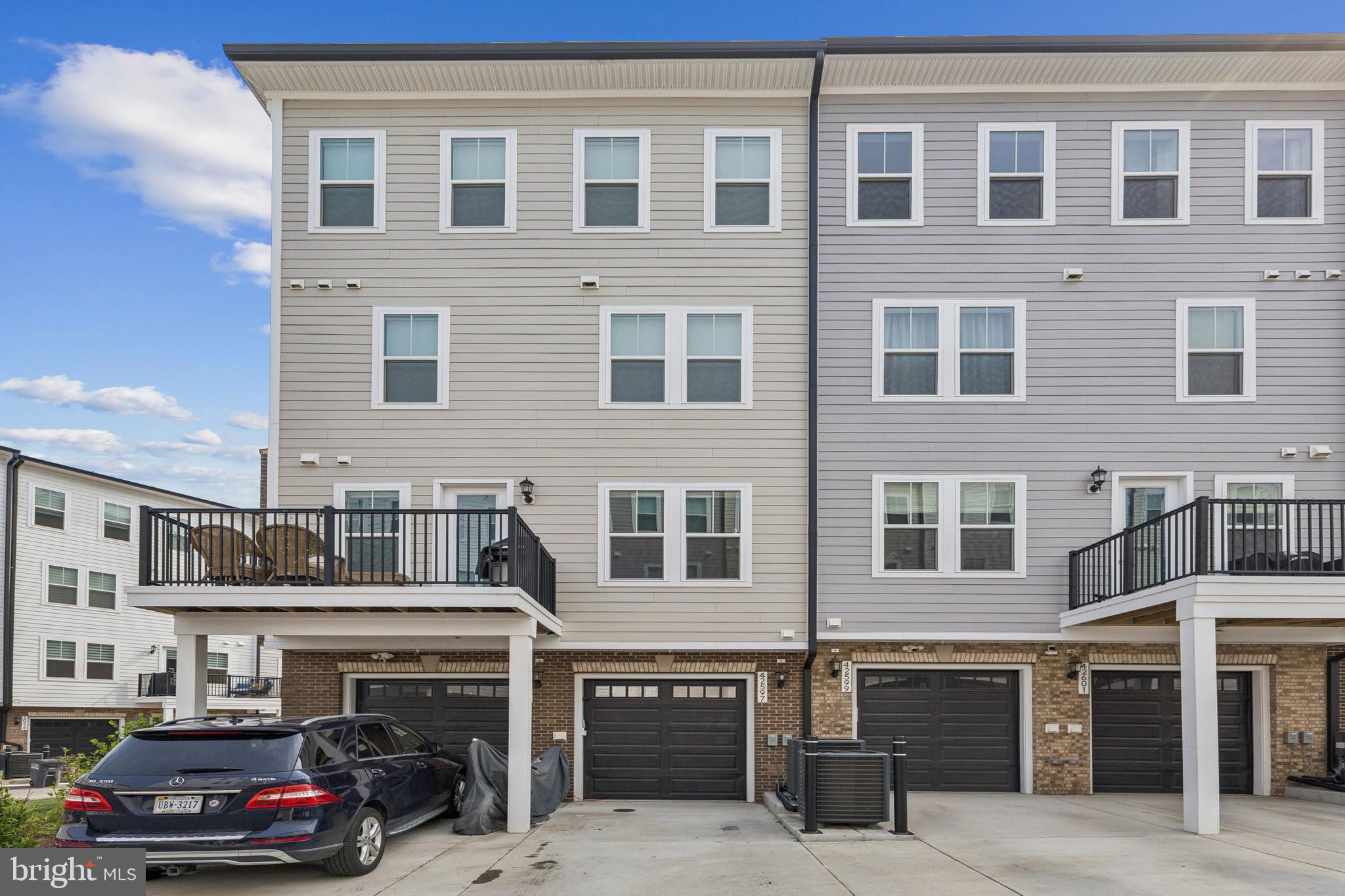 42597 Nubbins Terrace Ashburn, VA 20147 - Photo 40 of 40 a cars parked in front of a building