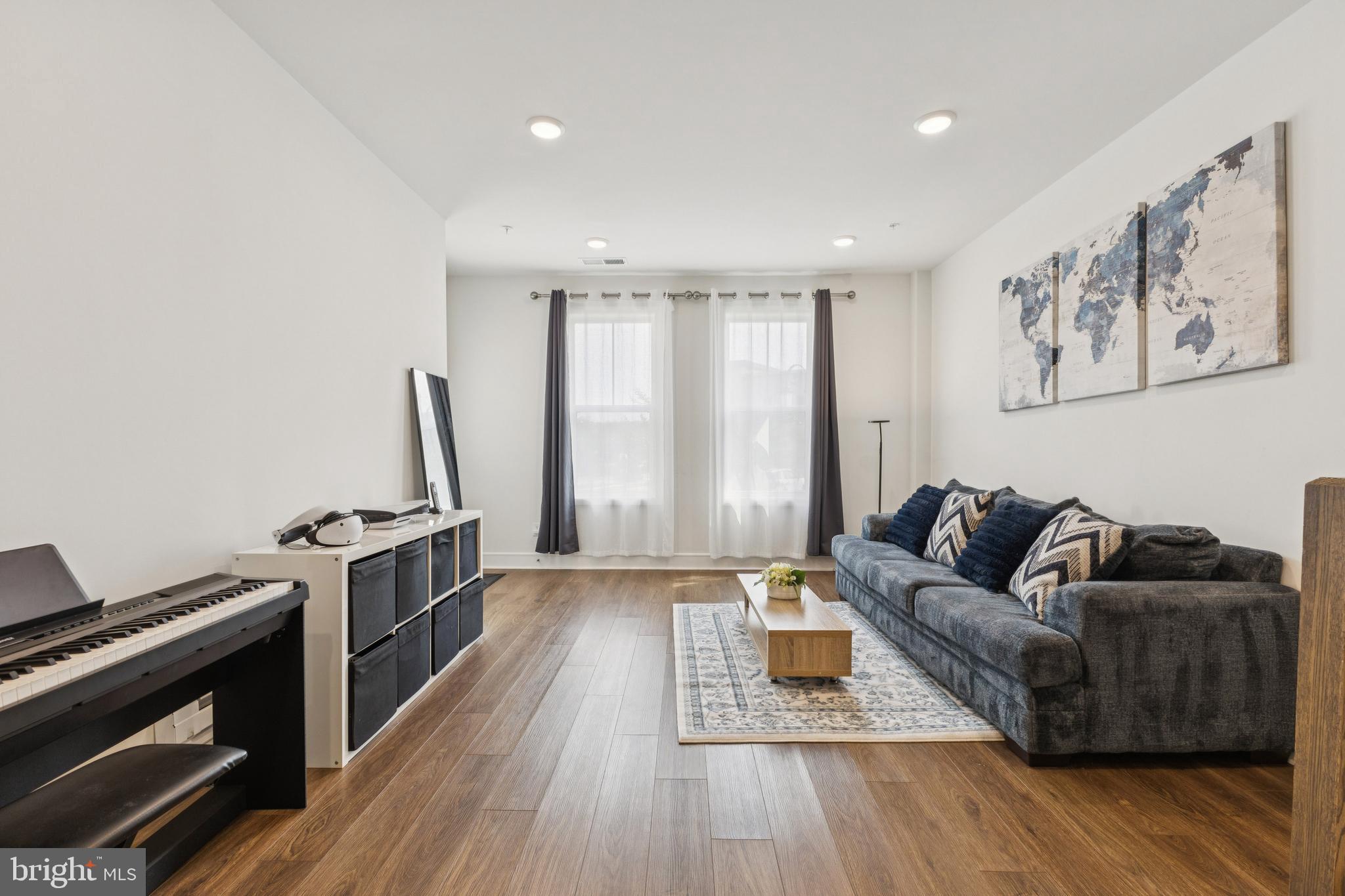 42597 Nubbins Terrace Ashburn, VA 20147 - Photo 4 of 40 a living room with furniture and a fireplace