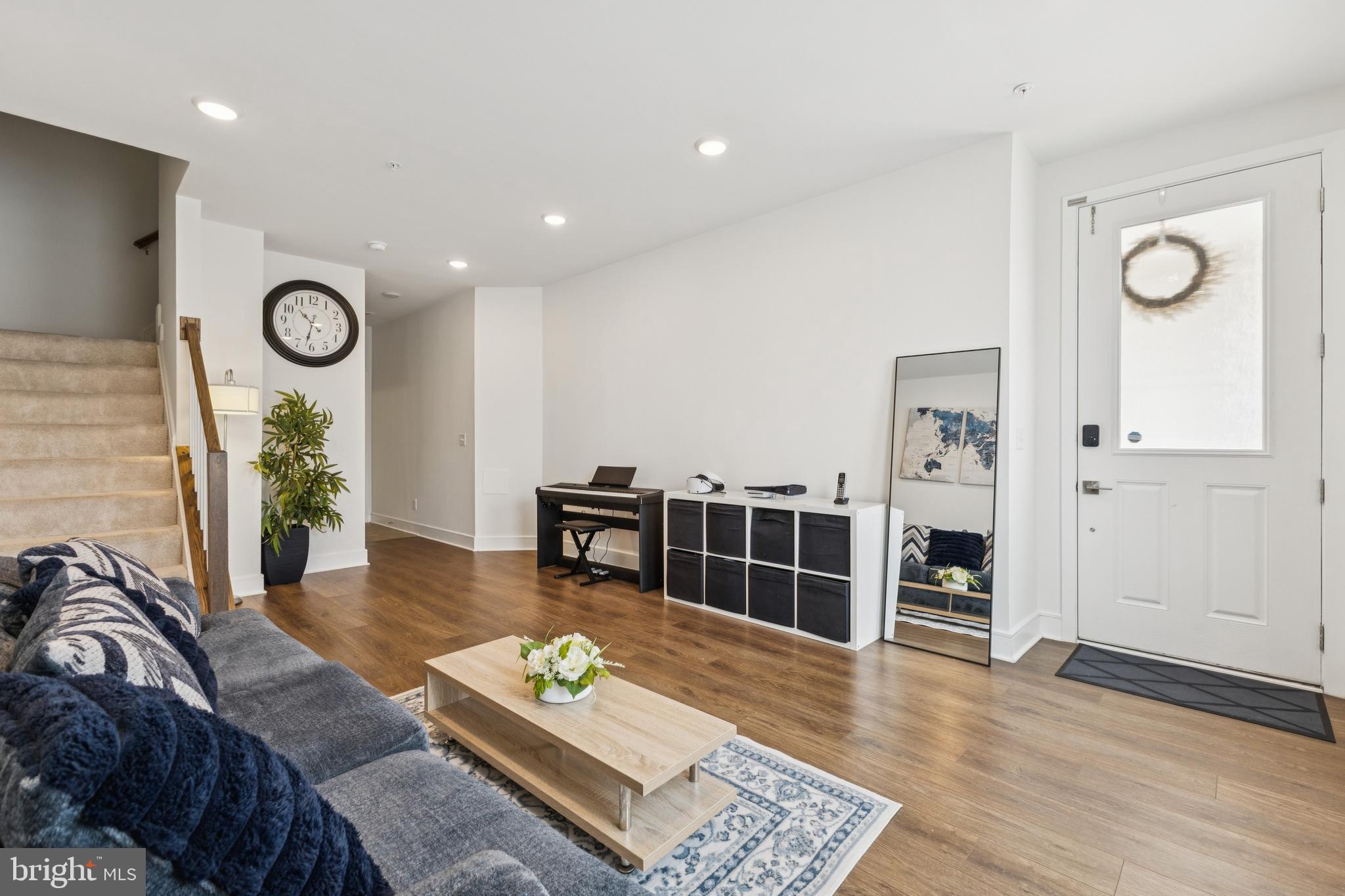 42597 Nubbins Terrace Ashburn, VA 20147 - Photo 6 of 40 a living room with furniture and wooden floor