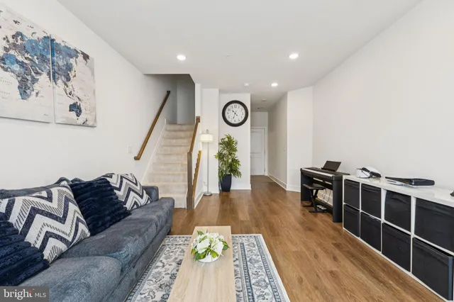 a living room with furniture and a rug