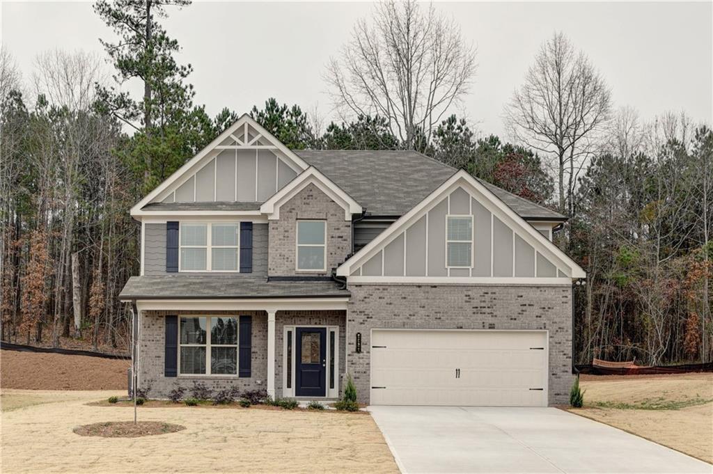 a view of house with a yard