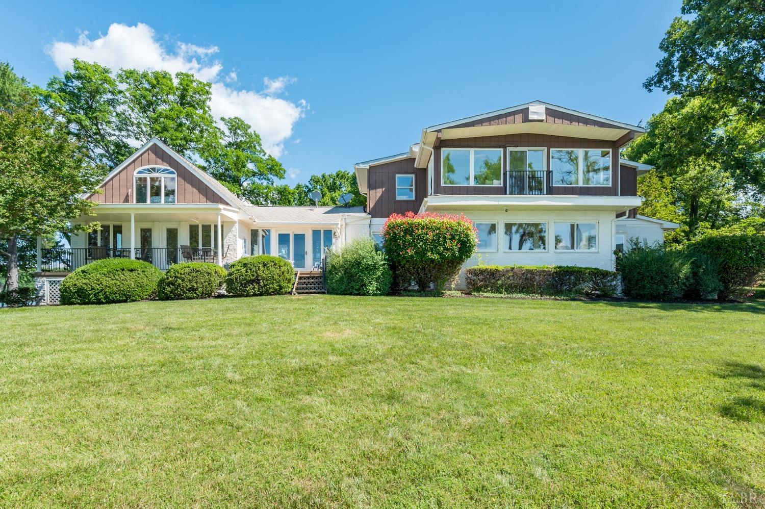 311 Anthony Home Road Huddleston, VA 24104 - Photo 2 of 70 a front view of a house with garden