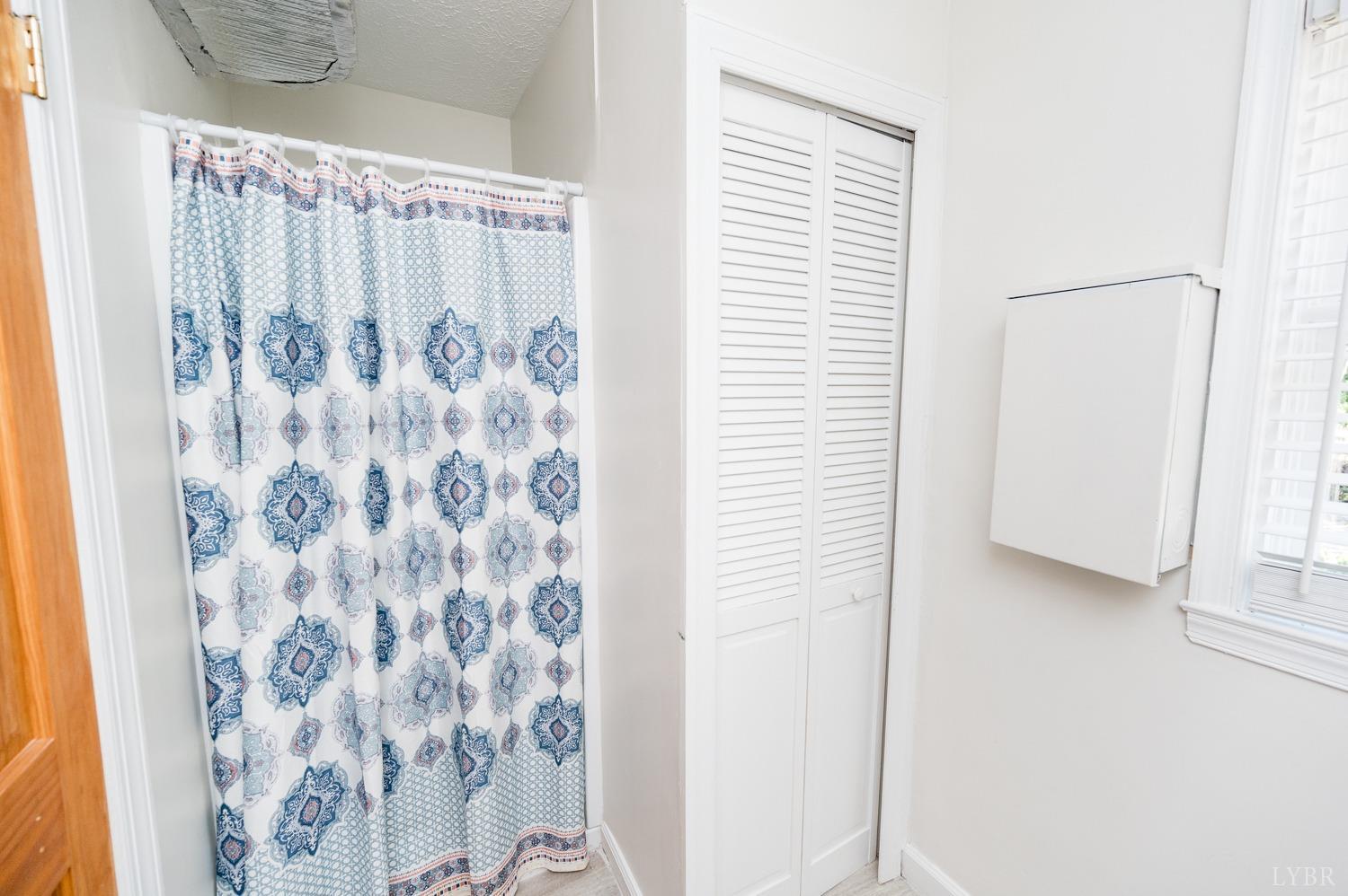 311 Anthony Home Road Huddleston, VA 24104 - Photo 29 of 70 a view of a bathroom with shower curtain