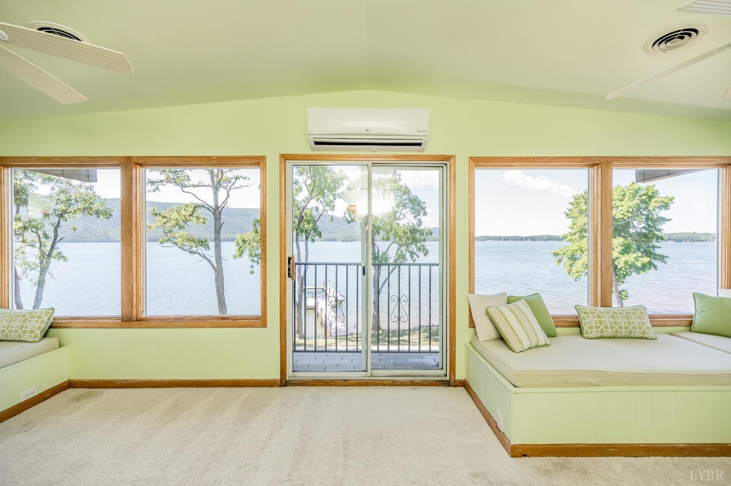 311 Anthony Home Road Huddleston, VA 24104 - Photo 40 of 70 a living room with a large window and a bed