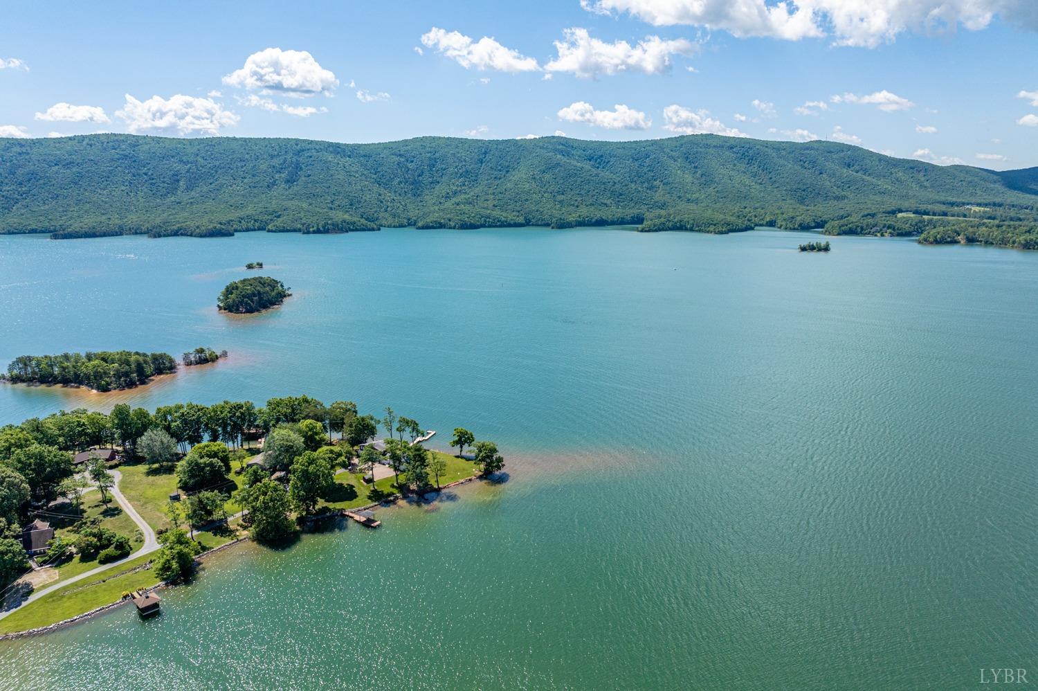 311 Anthony Home Road Huddleston, VA 24104 - Photo 67 of 70 a view of a lake with a mountain in the background