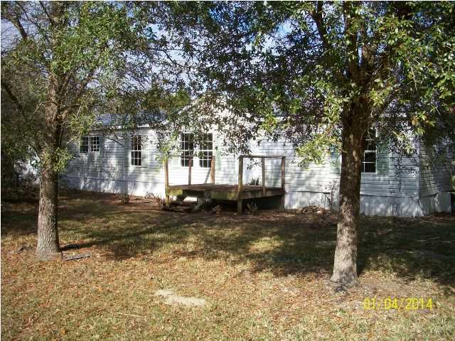 261 Don Graff Road Freeport, FL 32439 - Photo 1 of 20 a view of a yard with large trees