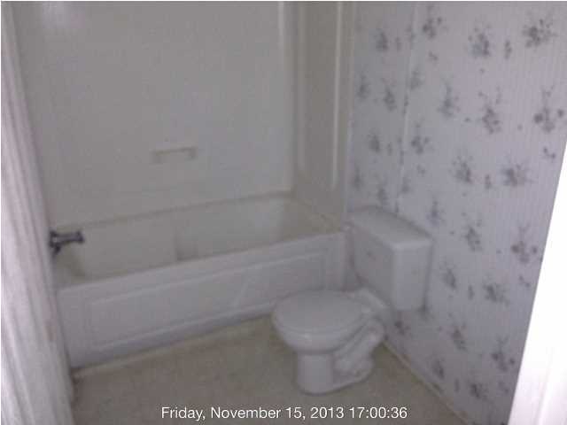 261 Don Graff Road Freeport, FL 32439 - Photo 15 of 20 a bathroom with a toilet and a shower