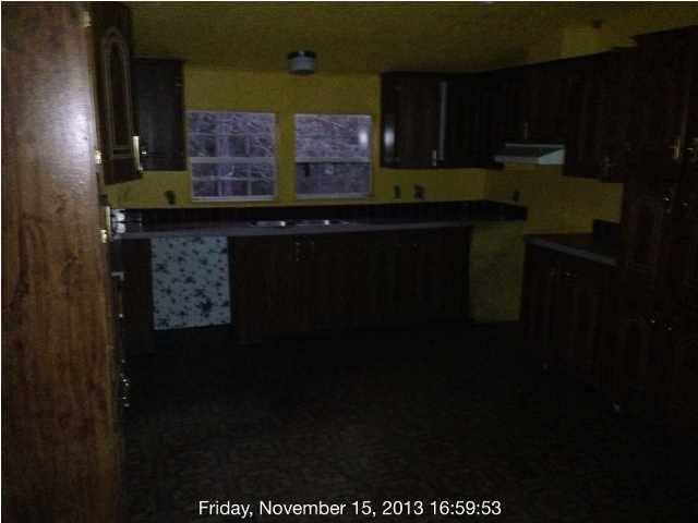 261 Don Graff Road Freeport, FL 32439 - Photo 20 of 20 a kitchen with a sink and cabinets