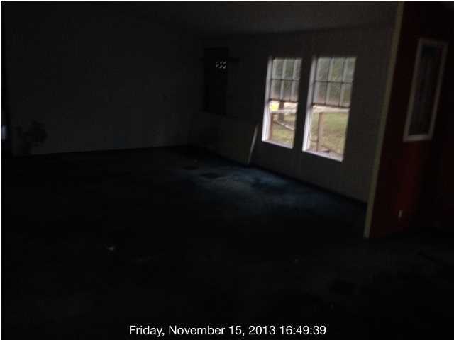 261 Don Graff Road Freeport, FL 32439 - Photo 4 of 20 a view of an empty room and window