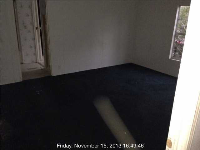 261 Don Graff Road Freeport, FL 32439 - Photo 5 of 20 a view of an empty room and wooden floor