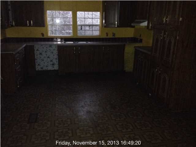 261 Don Graff Road Freeport, FL 32439 - Photo 9 of 20 a kitchen with a sink