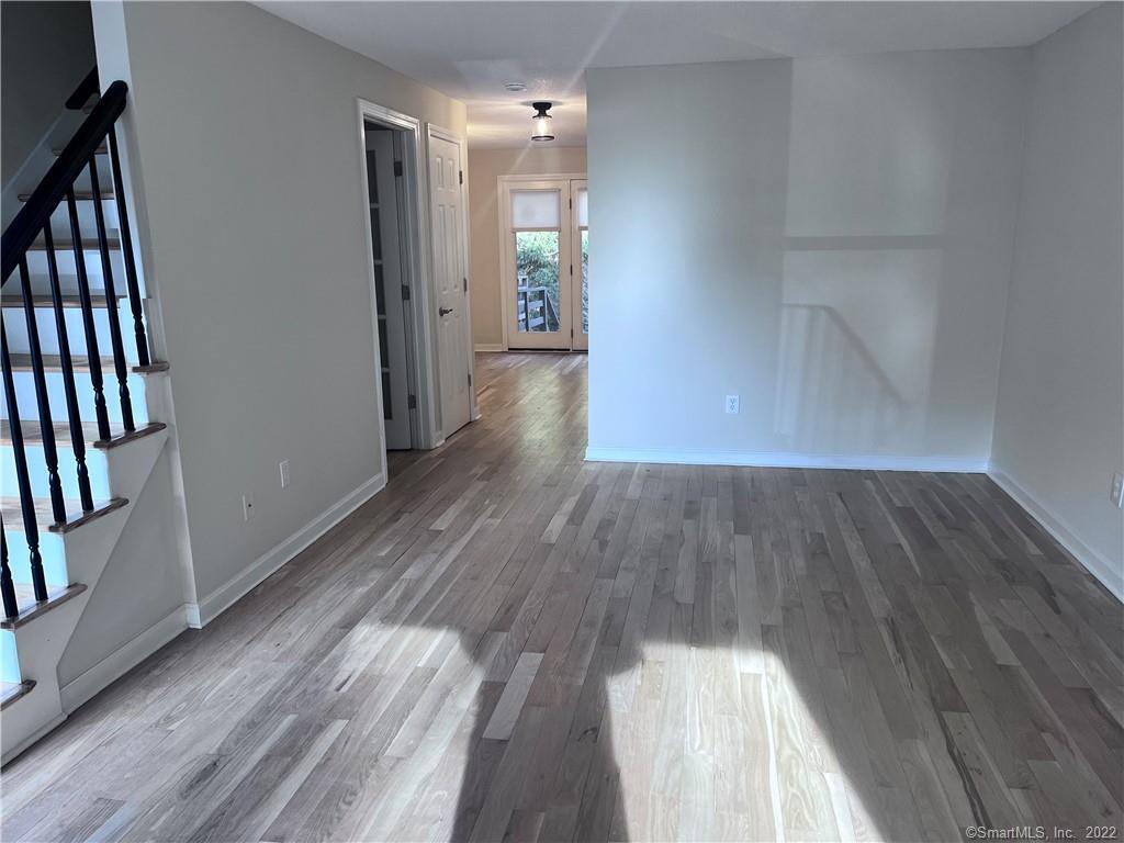 745 Greens Loop, Unit 745 Cheshire, CT 06410 - Photo 12 of 22 a view of hallway with wooden floor