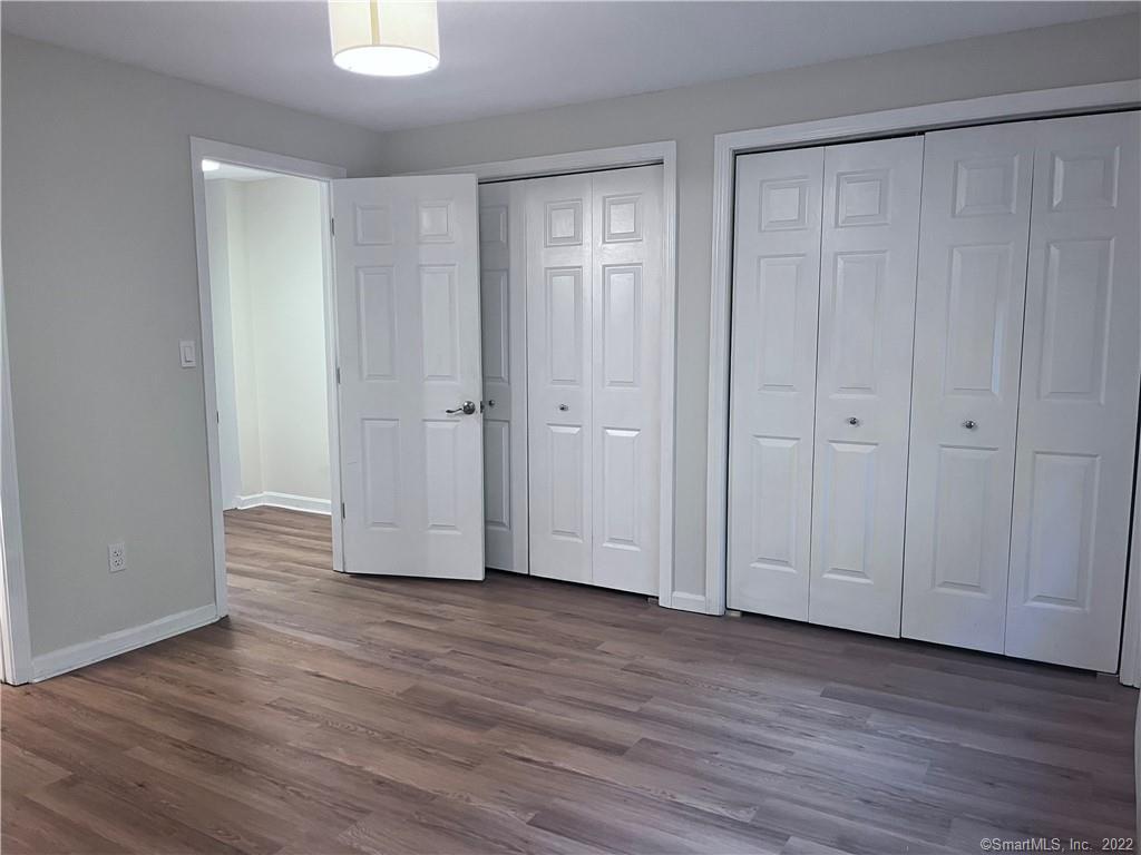 745 Greens Loop, Unit 745 Cheshire, CT 06410 - Photo 16 of 22 a view of empty room with wooden floor