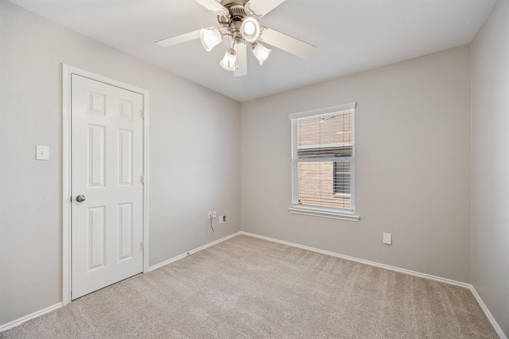 2271 Fieldcrest Drive Rockwall, TX 75032 - Photo 16 of 24 an empty room with windows and fan