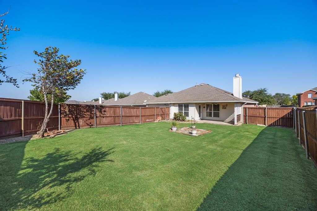 2271 Fieldcrest Drive Rockwall, TX 75032 - Photo 23 of 24 a view of a house with backyard and garden