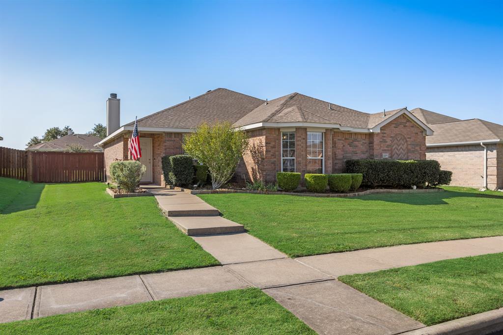 2271 Fieldcrest Drive Rockwall, TX 75032 - Photo 3 of 24 a front view of a house with a yard
