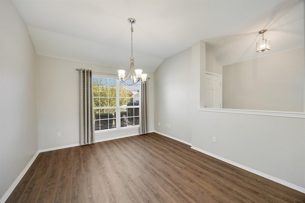 2271 Fieldcrest Drive Rockwall, TX 75032 - Photo 8 of 24 a view of an empty room with wooden floor and a window