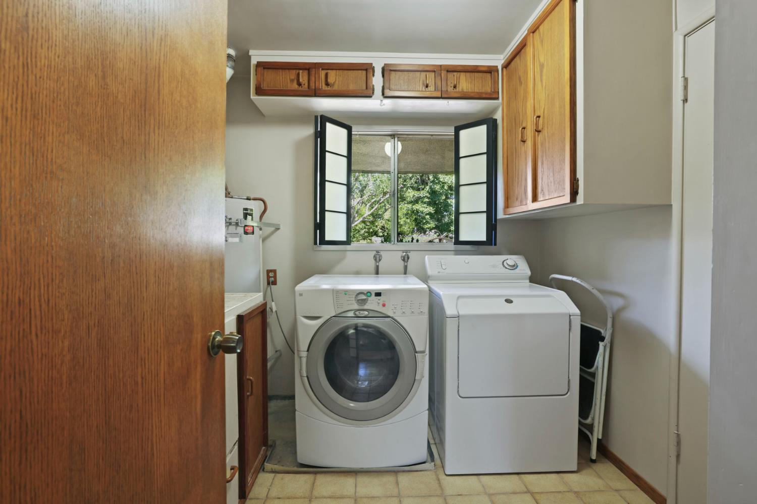 2406 Kenmore Court Modesto, CA 95350 - Photo 29 of 54 a utility room with dryer and washer