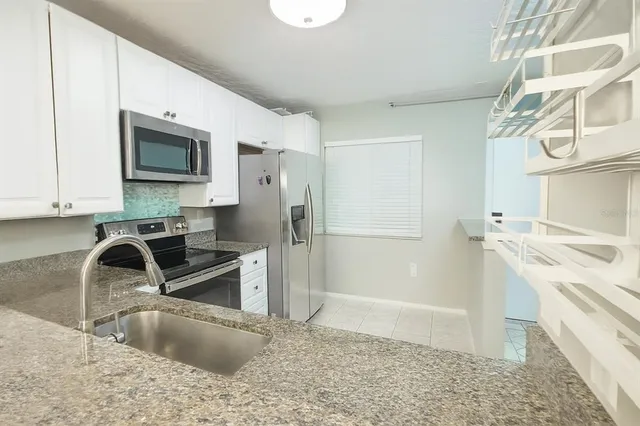 a view of a lake with a building in the background